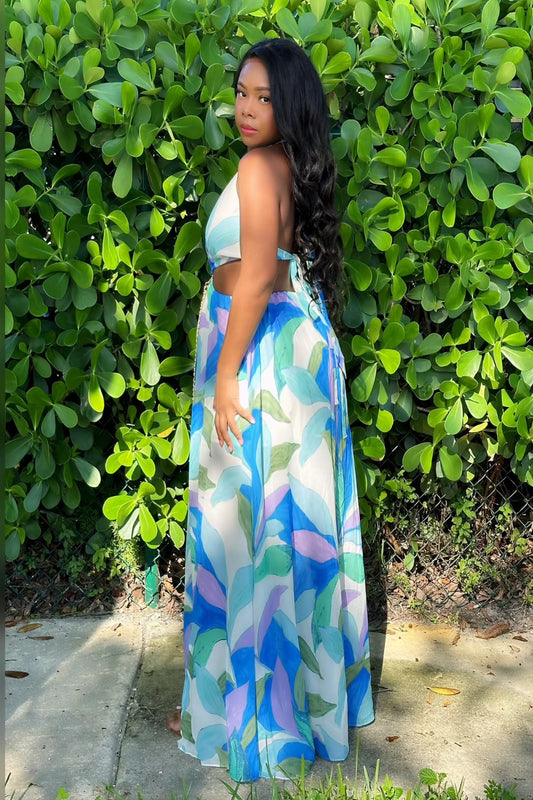 Blueberry Swirl Maxi Dress with vibrant blue and green swirl prints, featuring side cutouts and flowy silhouette. Trendy urban-chic summer style.